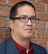 Headshot of Professor Chris Alcantara