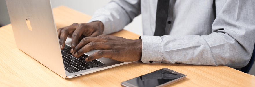 Man typing on laptop computer