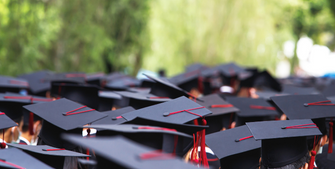 Graduating class wearing grad caps