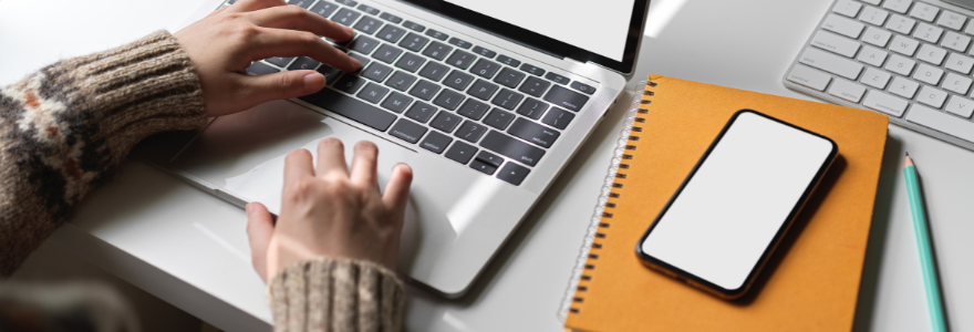 Image of student typing on laptop